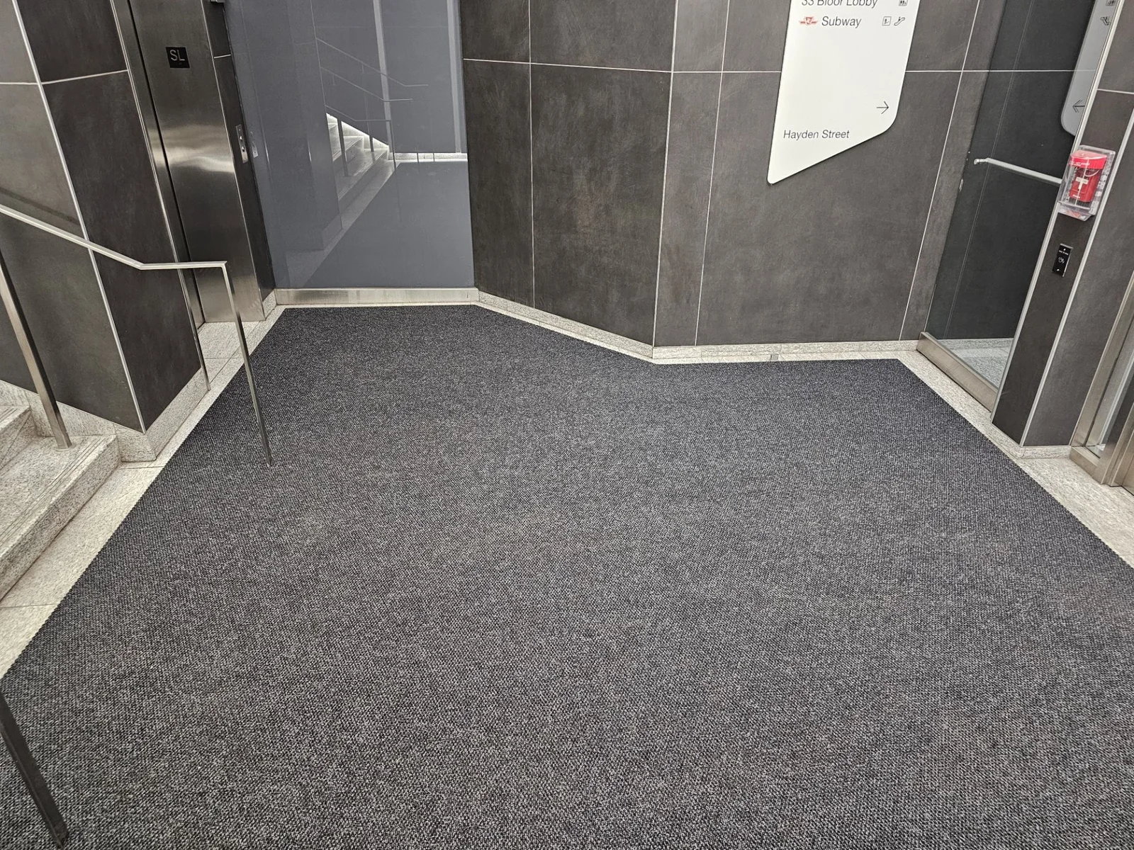 Commercial entrance mats in a building vestibule